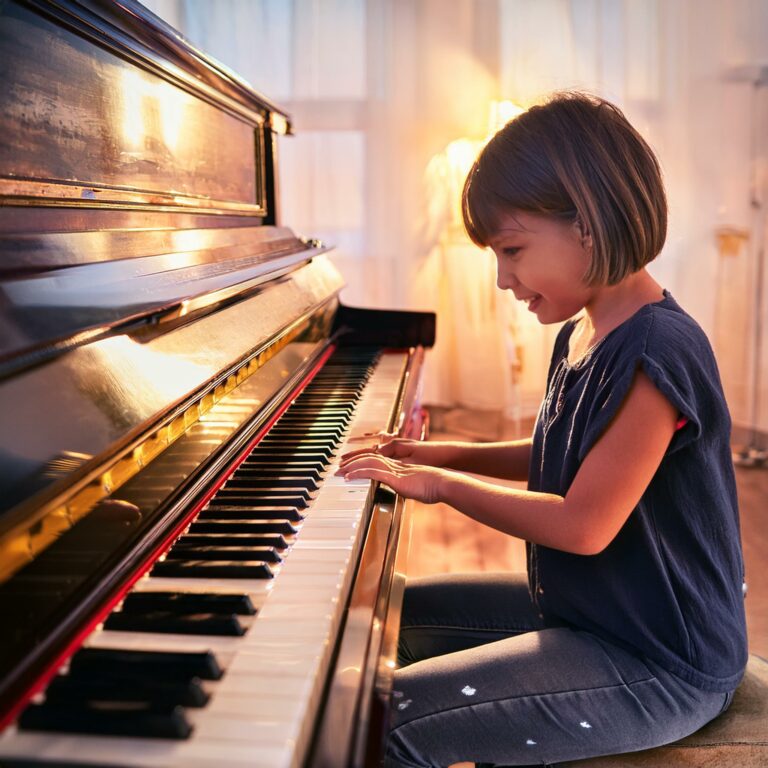 A child playng piano representing How Easy Is It To Learn To Play Piano